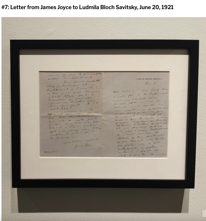 A framed handwritten letter in French from James Joyce to Ludmila Bloch Savitsky, dated 20 June 1921, hanging on a gallery wall.